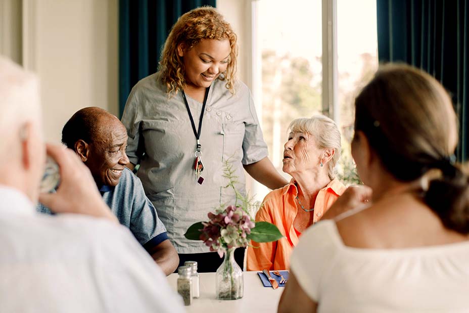 A group of care home residents enjoying a social activity together