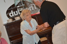 EachStep resident Lillian Houghton, 95, and volunteer Dave Sawdon, celebrating EachStep’s 1st birthday