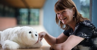 Professor Glenda Cook with the robotic seal