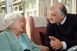 Audit lead Professor Alan Sinclair talking to a care home resident with diabetes