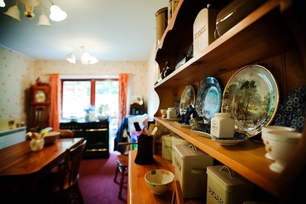 Residents with dementia at Sanctuary Care’s Ashley House Care Home enjoy the traditional country kitchen 