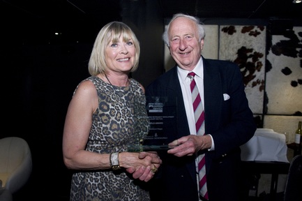 Chairman of the judging panel, David Hoppit, presents the gold award to Elisabeth Parker, village manager at Richmond Letcombe Regis