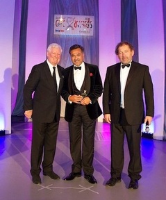 Dr Chai Patel, (centre) receives his Care Personality of the Year award
