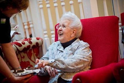 A resident at Sanctuary's Beach Lawns Care Home in Weston-super-Mare enjoys some Christmas cake