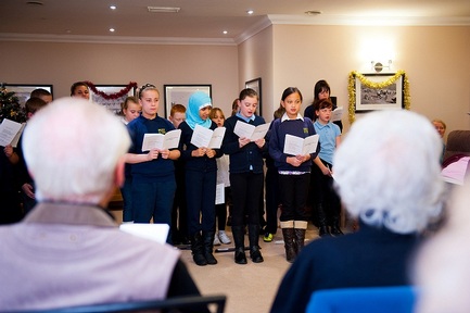 Children singing carols at Sanctuary's Park View Care Home in Sheffield.