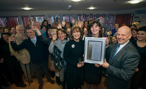 Pictured are Mario and Gill Kreft, the proprietors of Pendine Park with Health Minister for Wales, Lesley Griffiths