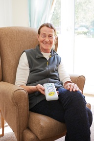 A care home resident using a Courtney-Thorne nurse call system