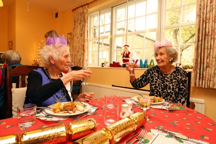 Two ladies enjoying lunch as part of Abbeyfield's Coping at Christmas campaign