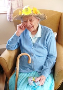 A resident at Elizabeth House models her Easter bonnet