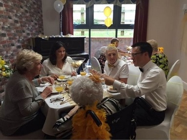 Matt Lowe with staff and residents at the pop-up  dining service