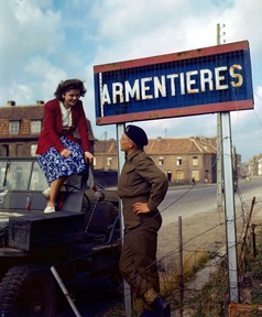 A World War II soldier and a sign in Armentieres
