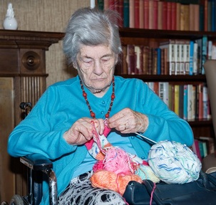 Diana gets to work on a colourful hat