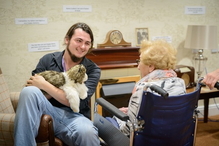 Puppeteer Ben Spooner brings cat to meet Jewish Care resident Credit: Mike Stone