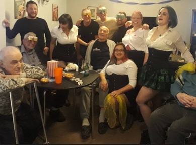Burlesque dances pose with residents and staff.  Credit: Milton Lodge Care Home