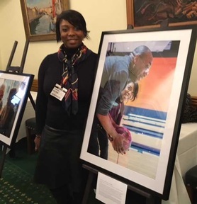 Care home owner Sonia Parnell next to a photograph of her bowling with resident. Credit: Angeline Albert