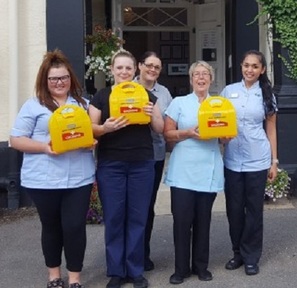 In-house trainer Caroline Sandham with care home staff. Credit: Dudbrook Hall.