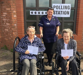 Care Home residents Sheila Coburn and Shirley Naylor with manager Cassie McCloskey outside polling station. Credit: Hill Care