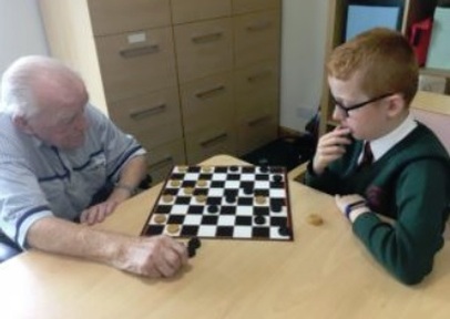 Roy is still beating Kian at draughts. Credit: Beech Manor Care Home in Blairgowrie.