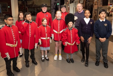 Gyles Brandreth and Chelsea Pensioners Roy Palmer and Simon de Buisseret with pupils from Marlborough Primary School and Garden House School. Credit: Mosaic Publicity