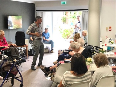 Ian Macdonald gets audience going with laughter yoga.