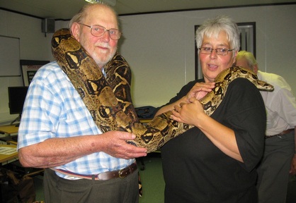 Elderly people benefiting from the calming effect of snakes. Credit: Snakey Sue.