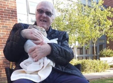Brian Lace takes care of the rabbits and helps deliver pet therapy. Credit: St Paul's Care Centre.