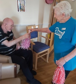 Mary Kelly, as Oomph lead, helps motivate fellow residents during activity sessions. Credit: St Paul's Care Centre.