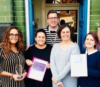Christopher Tansley, managing director at Right At Home Nottingham and care workers celebrate  CQC 'Outstanding' rating. Credit: Right At Home (Nottingham).