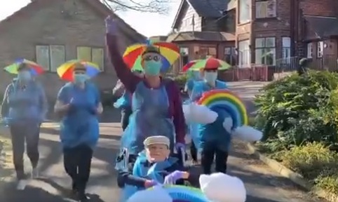 Staff at The Old Vicarage care home in Bolton march in rainbow hats. Credit: The Old Vicarage care home.