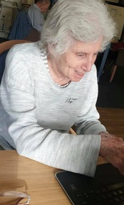 A member of the Silver Surfer's computer club interacting with a student from The Mount, Mill Hill International. Credit: Carlton court Care Home