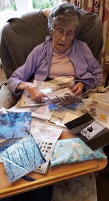 A resident from Galahill House choosing a winning photo. Credit: Mansfield Care