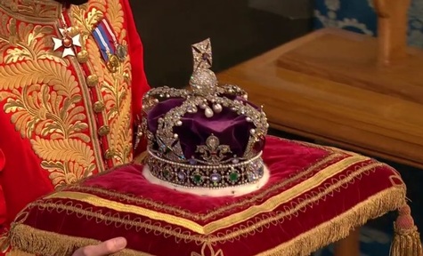 The Queen's crown is brought into the House of Lords for the Queen's Speech. Credit: BBC