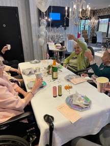 Some of the residents at Finney House toasting the happy couple. Credit: L&M Healthcare