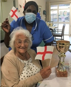 Care home resident Joan's birthday wish is an England win. Credit: Bupa