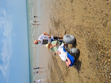 Mary Wood on her first trip in a beach wheelchair