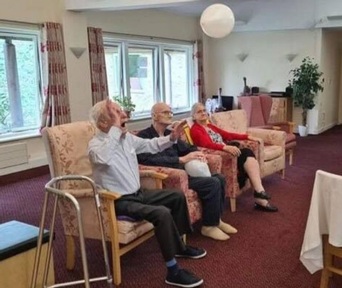 Residents compete in balloon volleyball at Langdon House care home. Credit: CHS Group