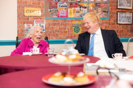 Boris Johnson chats with one of the care home's residents. Credit: Canford Healthcare
