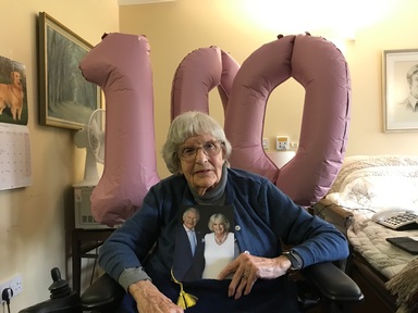 Ms Hunter celebrating her 100th birthday along with a card from King Charles III. Credit: Royal Star & Garter.